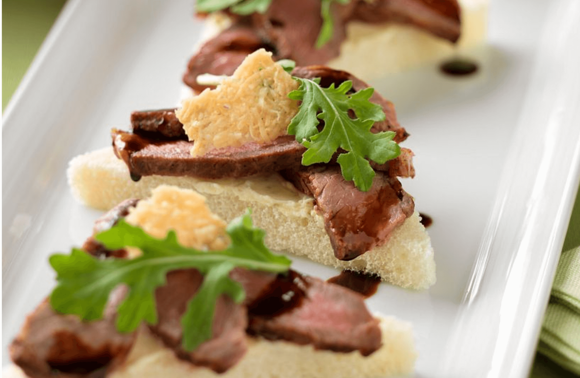 Beef Crostini with Parmesan Crisps and Balsamic Drizzle