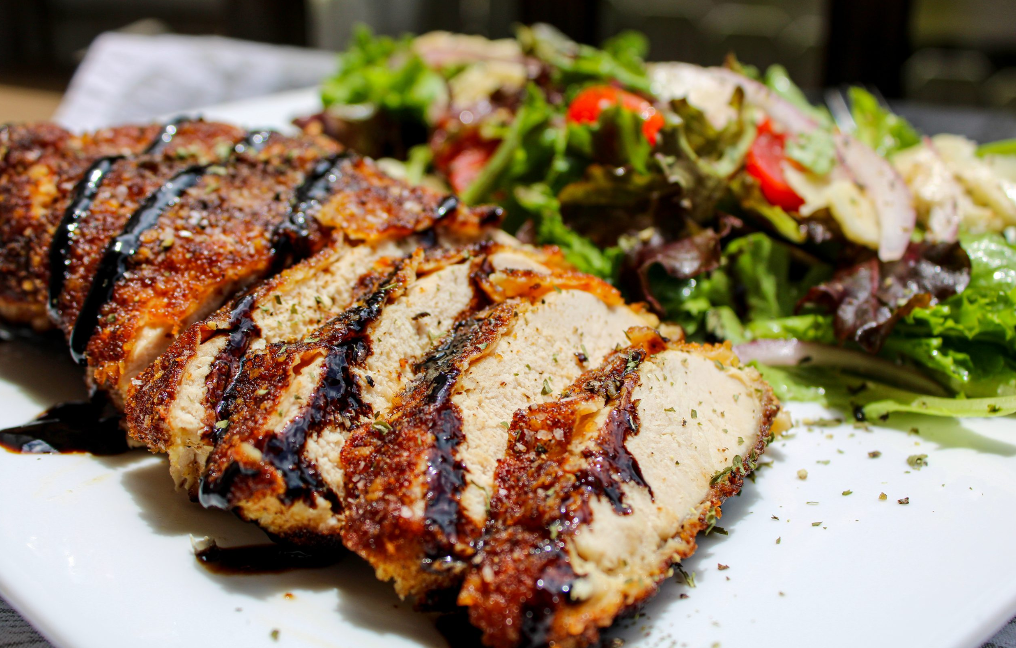 Wild Turkey Milanese with Mixed Greens & Flavored Balsamic Reduction