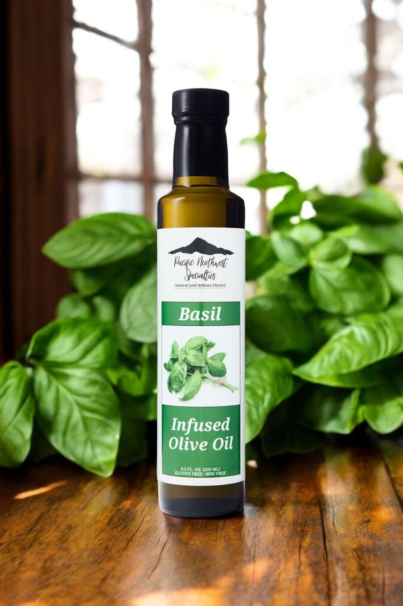 Basil infused olive oil bottle surrounded by fresh basil leaves on a wooden surface.