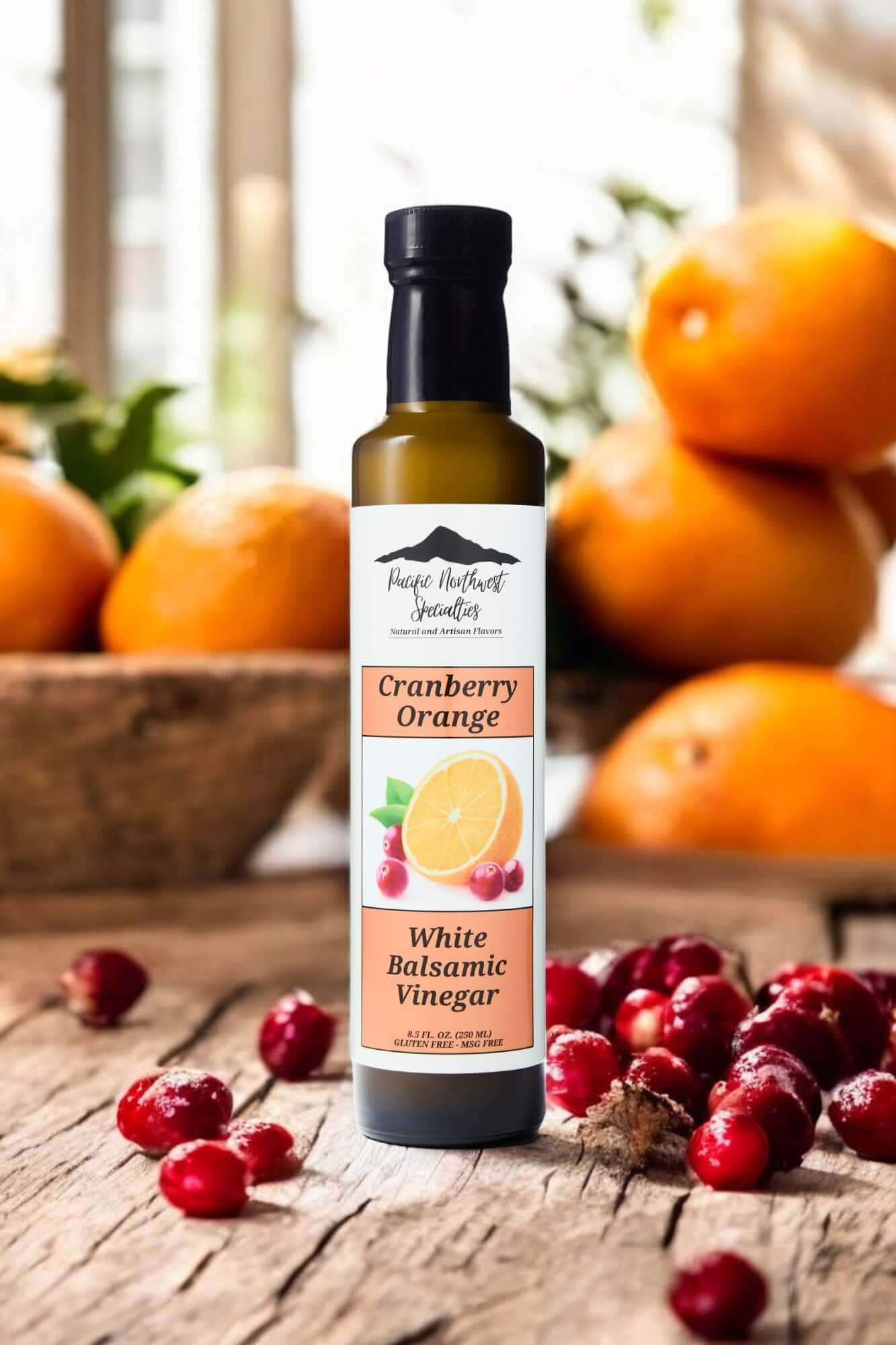 Cranberry Orange White Balsamic Vinegar bottle with fresh oranges and cranberries in a rustic kitchen setting.