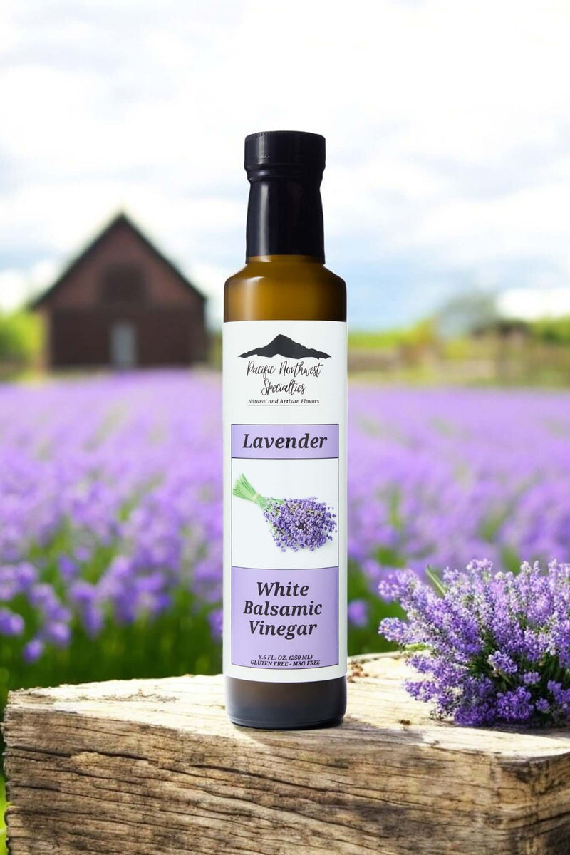Bottle of Lavender White Balsamic Vinegar set in a lavender field, showcasing its aromatic and flavorful essence.