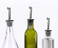 Stainless steel pour spouts with hinged caps for fast pouring from various bottles.